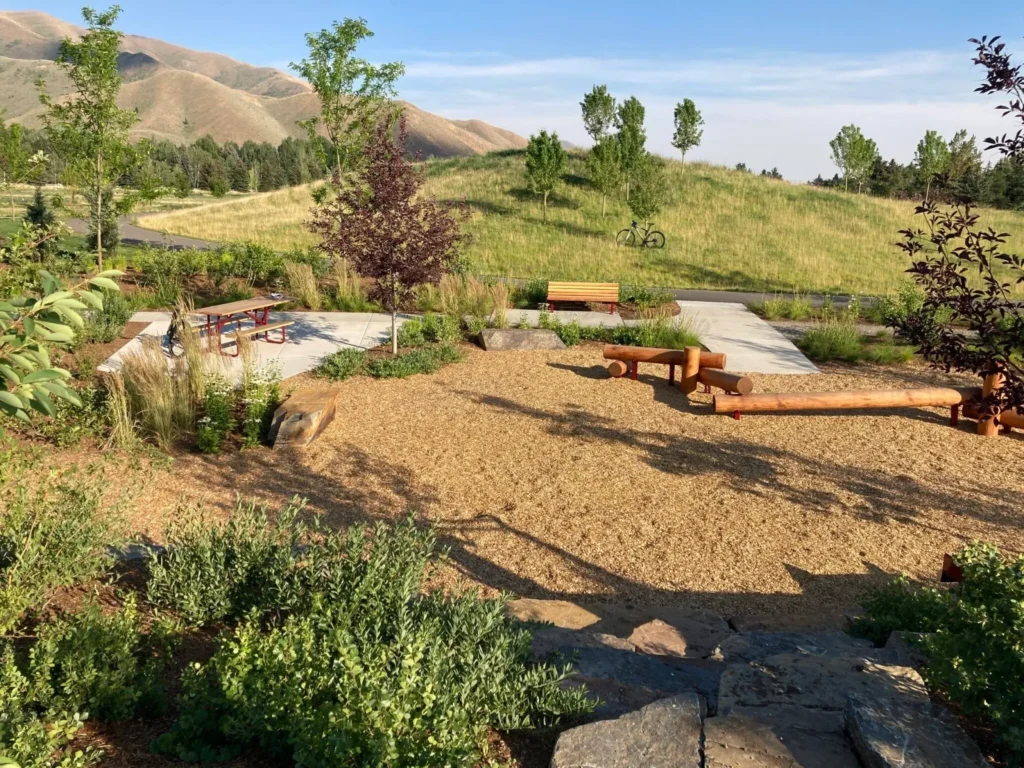 Small park with picnic table and hills